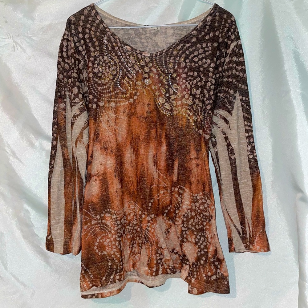 Gorgeous rhinestoned design, long
sleeve top.